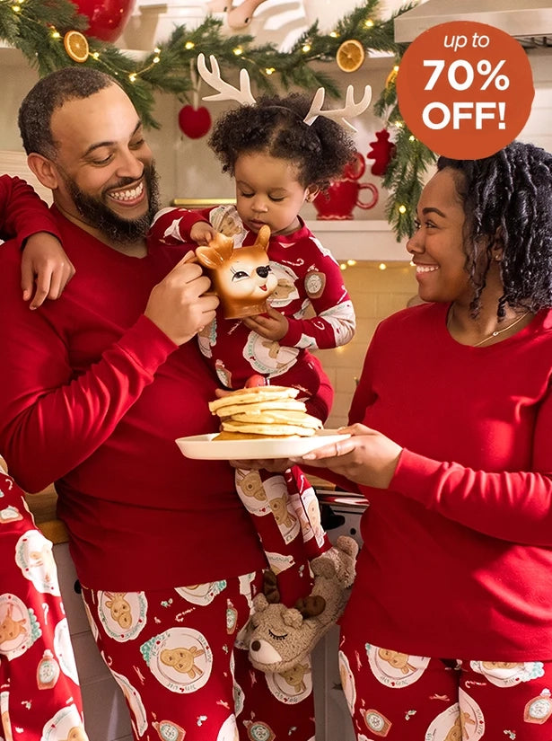 Family wearing matching holiday pajamas