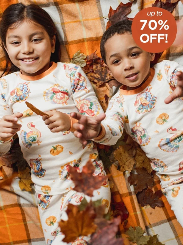 Children wearing Thanksgiving pajamas